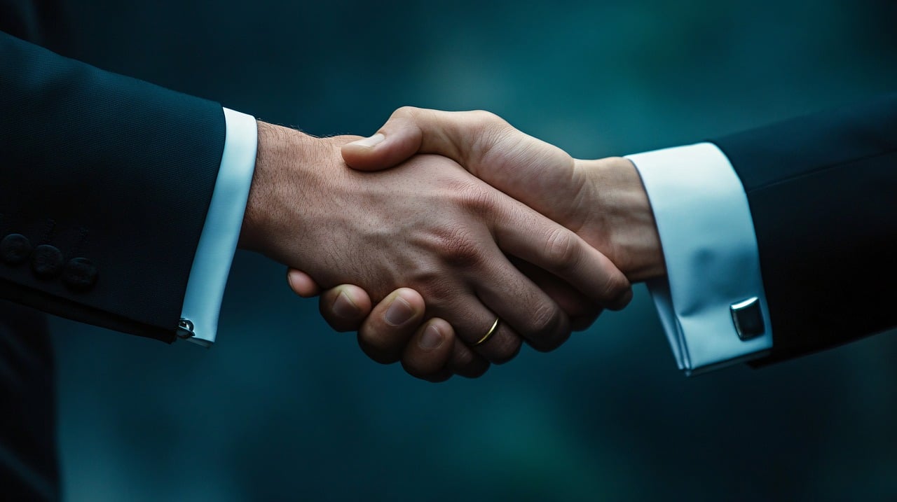 Business partnership handshake